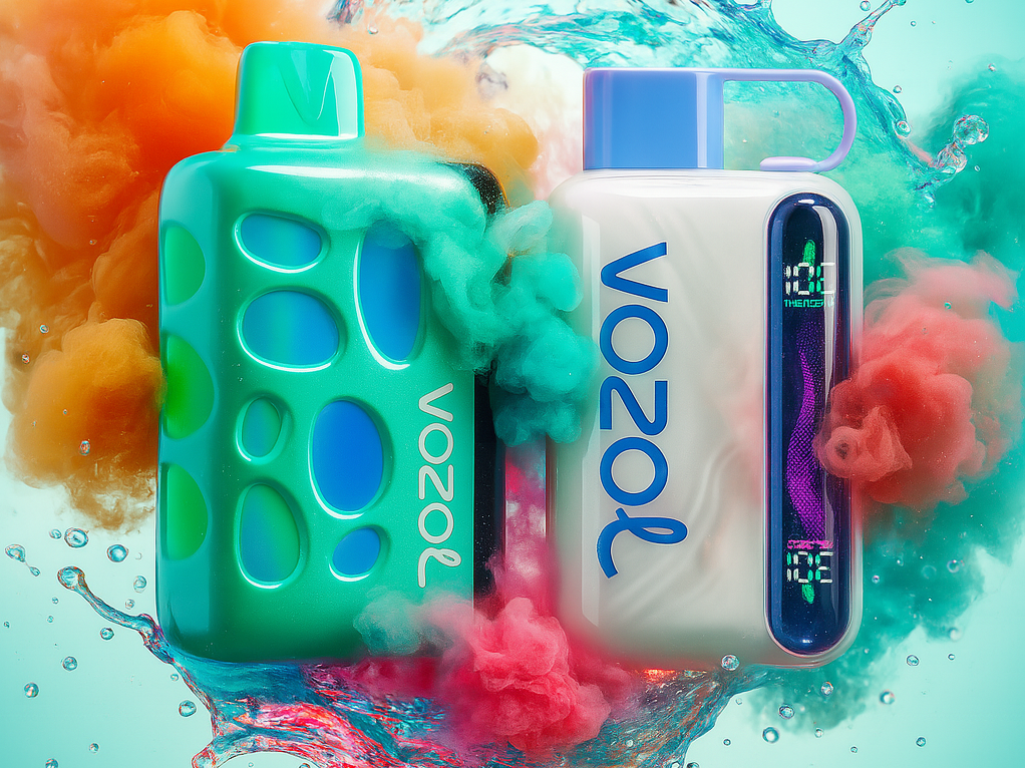 A colorful and dynamic product shot features two rectangular disposable vape devices against a light, hazy background. The left device is a bright teal color with blue accents visible through its cutouts, and the right device is white with a blue mouthpiece and a luminous vertical screen. Both vapes are enveloped in billowing clouds of orange, teal, and pink smoke, with water splashing up from below, suggesting a vibrant and refreshing product.